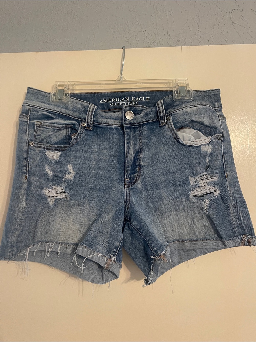 American Eagle Outfitters faded blue distressed denim shorts - size 14